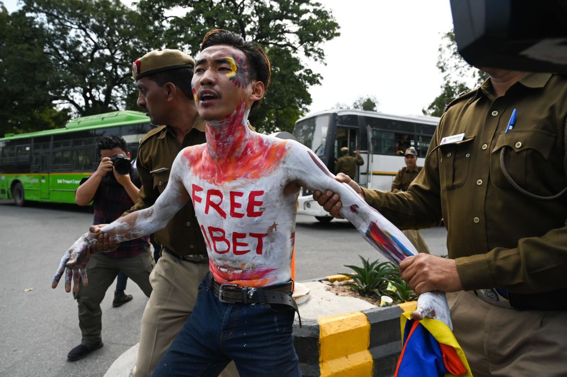 A Tibetan exile activist is detained by Indian police during a protest to commemorate the anniversary of the 1959 Tibetan uprising against Chinese rule, near the Chinese embassy in New Delhi on March 12, 2019.