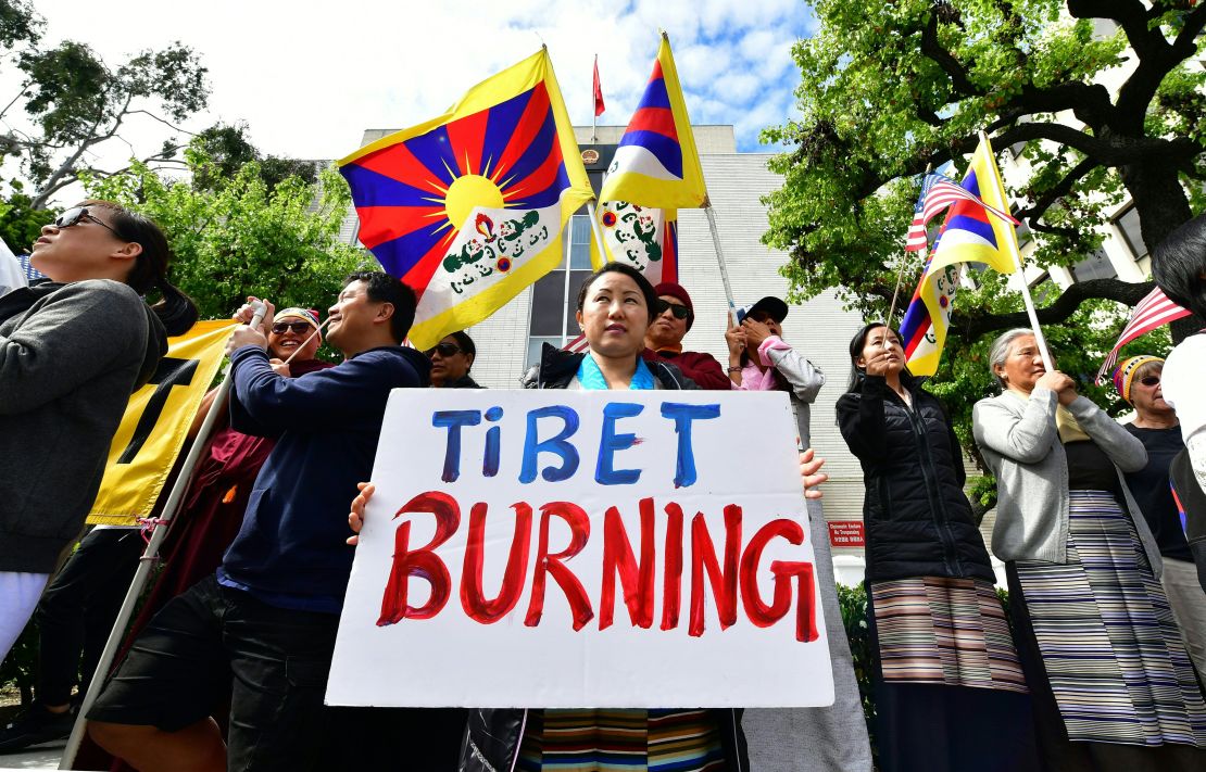 Tibetan flags are displayed as people protest in front of the Chinese Consulate General in Los Angeles on March 10.