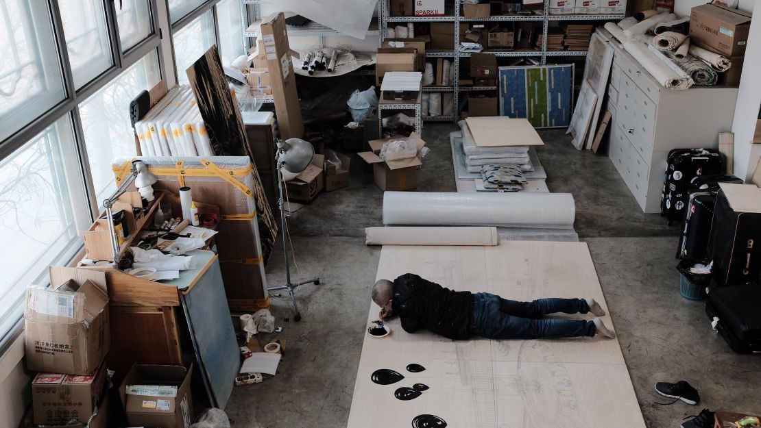 Sun Xun at work in his studio in Beijing.