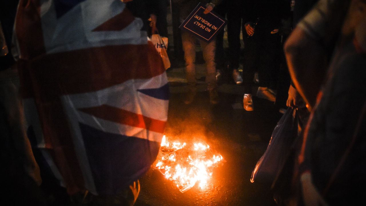 Pro-Brexit protesters burn an EU flag on Friday night in London.