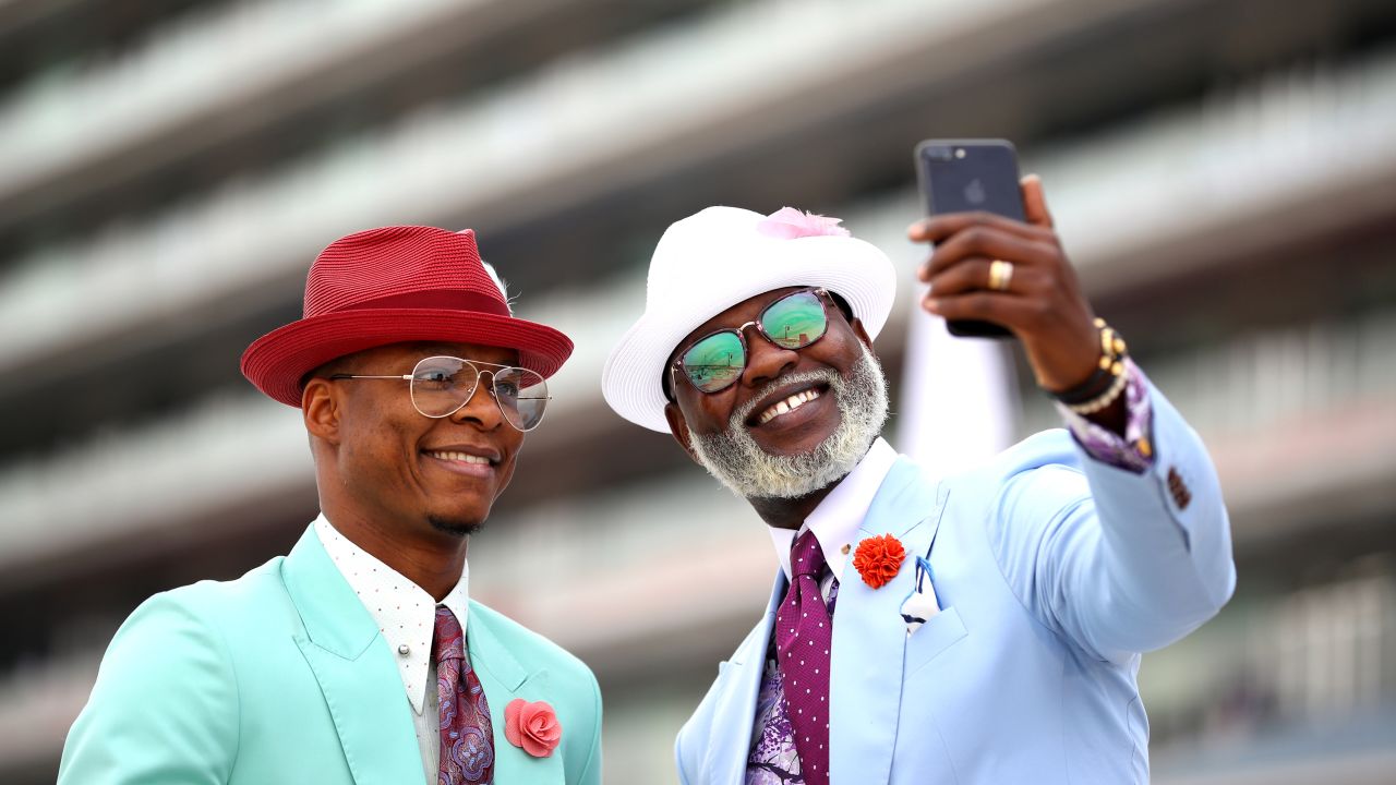 Two fans take a selfie at the Dubai World Cup at Meydan Racecourse on March 30 in Dubai.
