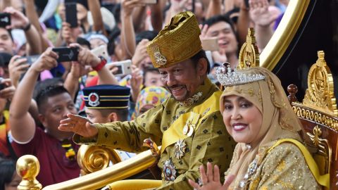 Sultan Hassanal Bolkiah and Queen Saleha ride in a 2017 procession to mark his golden jubilee.