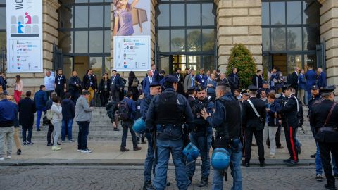 Riot police stand alert outside the World Congress of Families venue in the ancient city's Piazza Bra as a neo-fascist leader delivered a press conference outside.