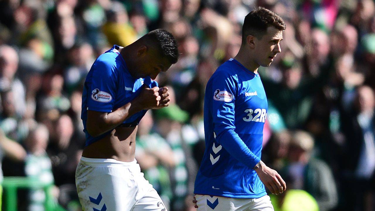 Morelos (L) walks off tafter he is sent off.