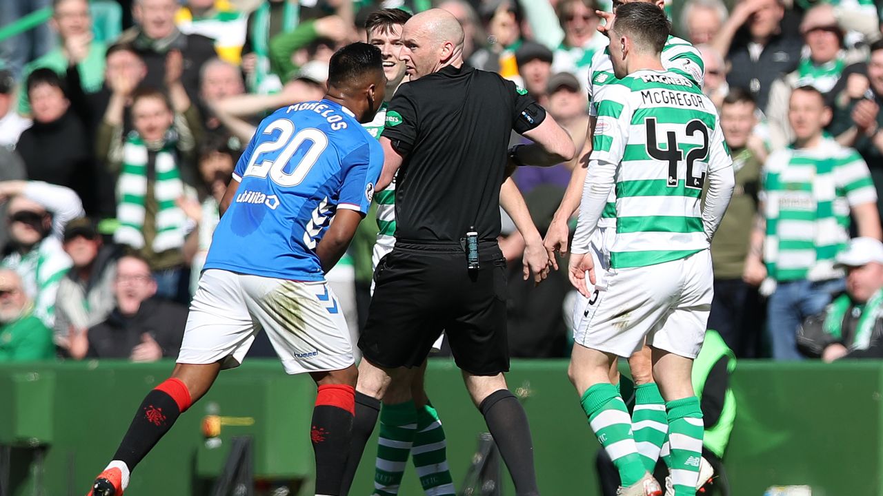 Alfredo Morelos argues with referee Bobby Madden after he is shown a red card.