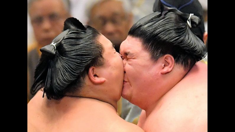 Daishoho, left, and Yago bump heads during their match on day 15 of the Grand Sumo Spring Tournament in Osaka, Japan, on Sunday, March 24.