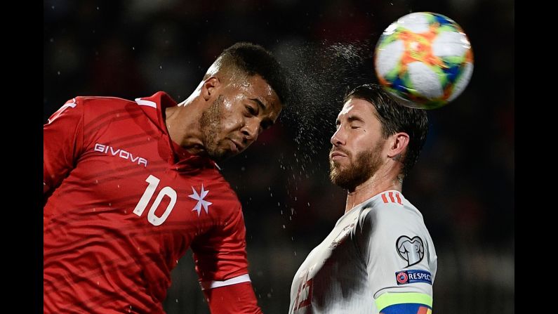 Malta's forward Kyrian Nwoko (L) and Spain's defender Sergio Ramos go for a header during the Euro 2020 Group F qualifying football match at the Ta' Qali Stadium in Malta on March 26.