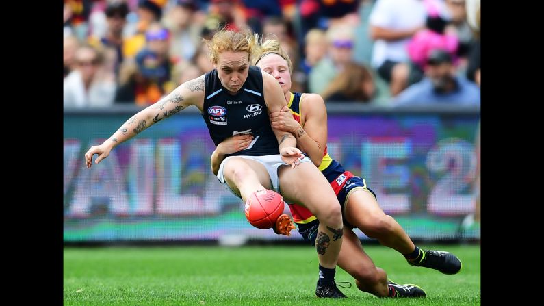 Dayna Cox of the Adelaide Crows tackles Tilly Lucas-Rodd of Carlton during the AFLW Grand Final match at Adelaide Oval on March 31 in Adelaide, Australia.