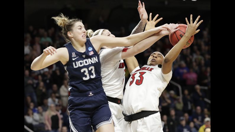 UConn Huskies guard Katie Lou Samuelson knocks the ball away from Louisville teammates Sam Fuehring, center, and Bionca Dunham, right, during the first half of the East Regional final of the 2019 NCAA Women's Basketball Tournament in Albany, New York, on March 31. The Huskies, who lost to Louisville earlier in the season, won the game to advance to their <a href="index.php?page=&url=https%3A%2F%2Fbleacherreport.com%2Farticles%2F2828859-uconn-makes-record-12th-straight-womens-final-four-in-win-vs-louisville" target="_blank" target="_blank">12th straight Final Four</a>, an NCAA record.
