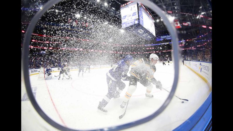 Boston Bruins center Joakim Nordstrom controls the puck as Tampa Bay Lightning defenseman Jan Rutta defends during the second period of their game at Amalie Arena on Monday, March 25. The Lightning won the game 5-4.