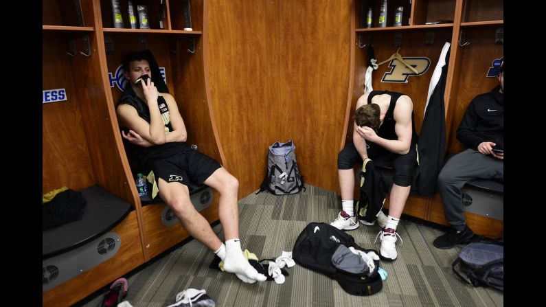 Purdue Boilermakers teammates Grady Eifert, left, and Ryan Cline sit in their lockers following an <a href="index.php?page=&url=https%3A%2F%2Fbleacherreport.com%2Farticles%2F2828727-no-1-virginia-win-in-ot-vs-carsen-edwards-purdue-advance-to-final-four" target="_blank" target="_blank">overtime loss</a> to the Virginia Cavaliers in the Elite Eight of the 2019 NCAA Men's Basketball Tournament. The Boilermakers held the lead late into the second half before Virginia hit a buzzer-beater to send the game into overtime. 