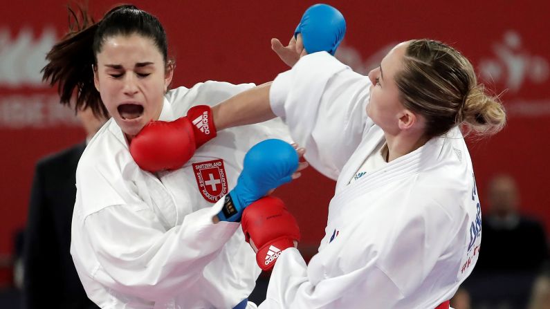 Alizee Agier (R) of France fights Elena Quirici (L) of Switzerland during the 68 kg women's category bronze medal match of 54th European Senior Karate Championship in Guadalajara, Spain, on March 30.