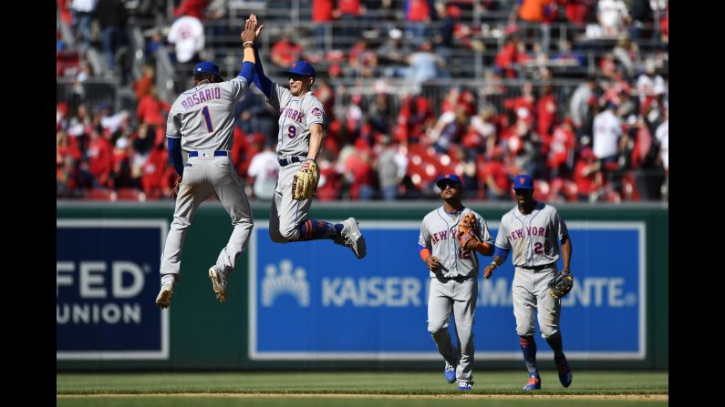 Amed Rosario (1) and Brandon Nimmo (9) of the New York Mets celebrate after the Mets defeated the Washington Nationals 2-0 on Opening Day at Nationals Park in Washington, DC, on on March 28. <a href="index.php?page=&url=https%3A%2F%2Fwww.cnn.com%2F2019%2F03%2F25%2Fsport%2Fgallery%2Fwhat-a-shot-sports-0324%2Findex.html" target="_blank">See 29 amazing sports photos from last week.</a>