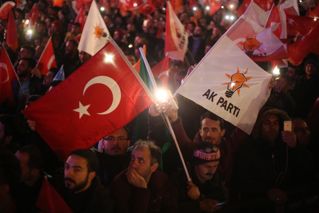 Supporters of ruling AK Party wave flags.