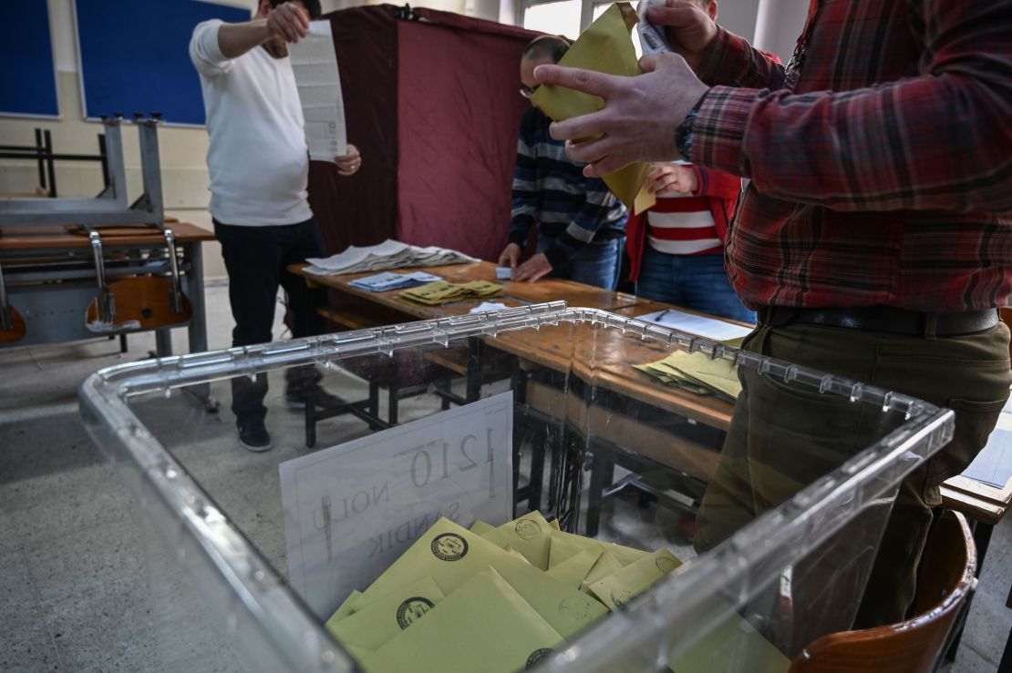 Electoral officers count ballots at a polling station in Istanbul on March 31.