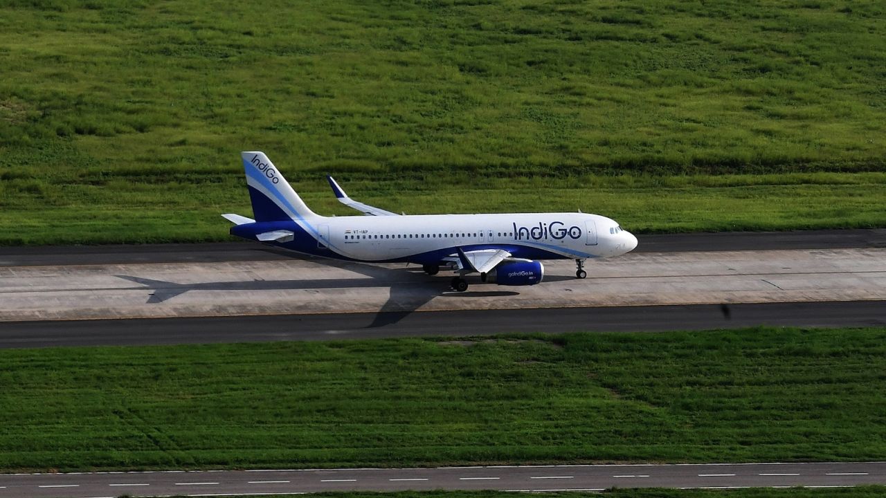 A plane owned by India's IndiGo airline taxis on the runway prior to take off at Indira Gandhi International Airport in New Delhi.
