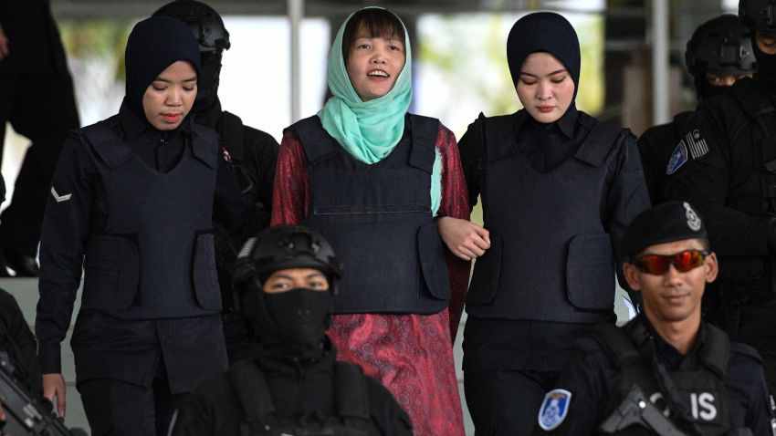 Vietnamese national Doan Thi Huong (C) is escorted by Malaysian police out of the High Court in Shah Alam on April 1, 2019. - A Vietnamese woman accused of assassinating the North Korean leader's half-brother will walk free in May after pleading guilty to a lesser charge, her lawyer said. (Photo by Mohd RASFAN / AFP)        (Photo credit should read MOHD RASFAN/AFP/Getty Images)