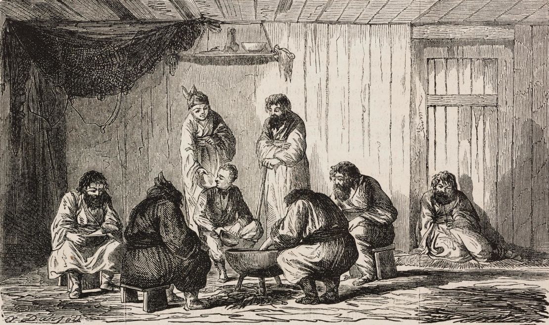A family of Ainu gives a meal to a Western man in a sketch.