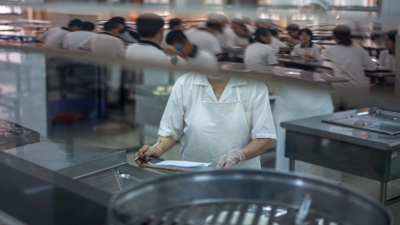 Students eat their lunch in their school in Shanghai in September 2017.