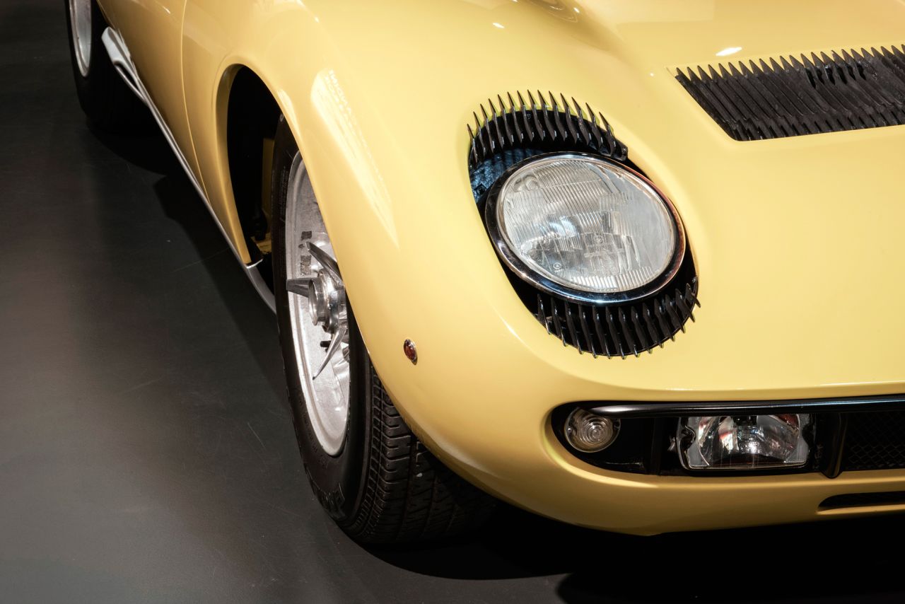 The Lamborghini Miura has curved edges and rows of black "eyelashes" around its headlights.