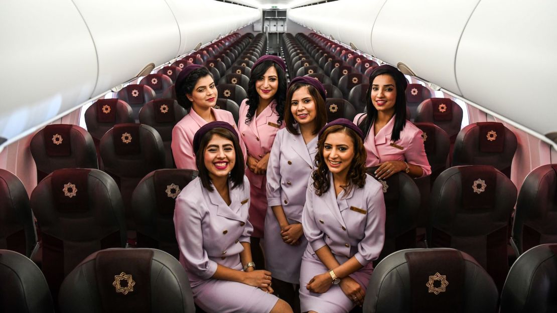 Vistara flight attendants pose aboard an Airbus A320neo during an event at the Indira Gandhi International Airport in New Delhi on September 1, 2018.