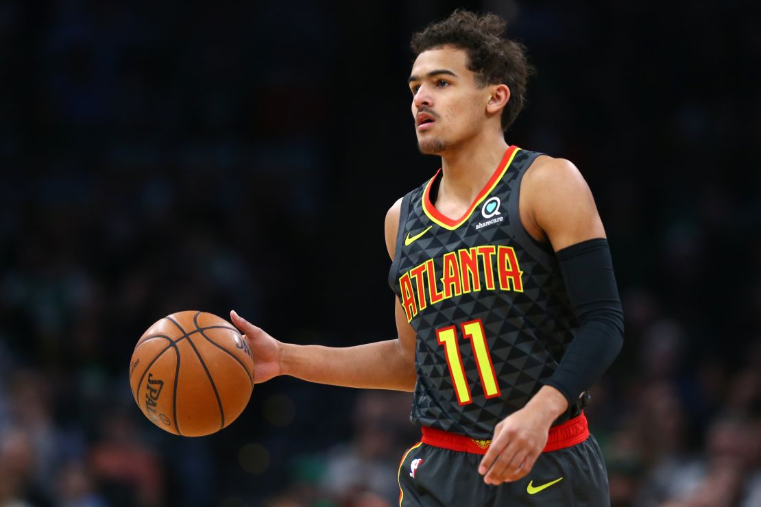 Trae Young of the Atlanta Hawks dribbles with the ball in a match against the Boston Celtics in December 2018.