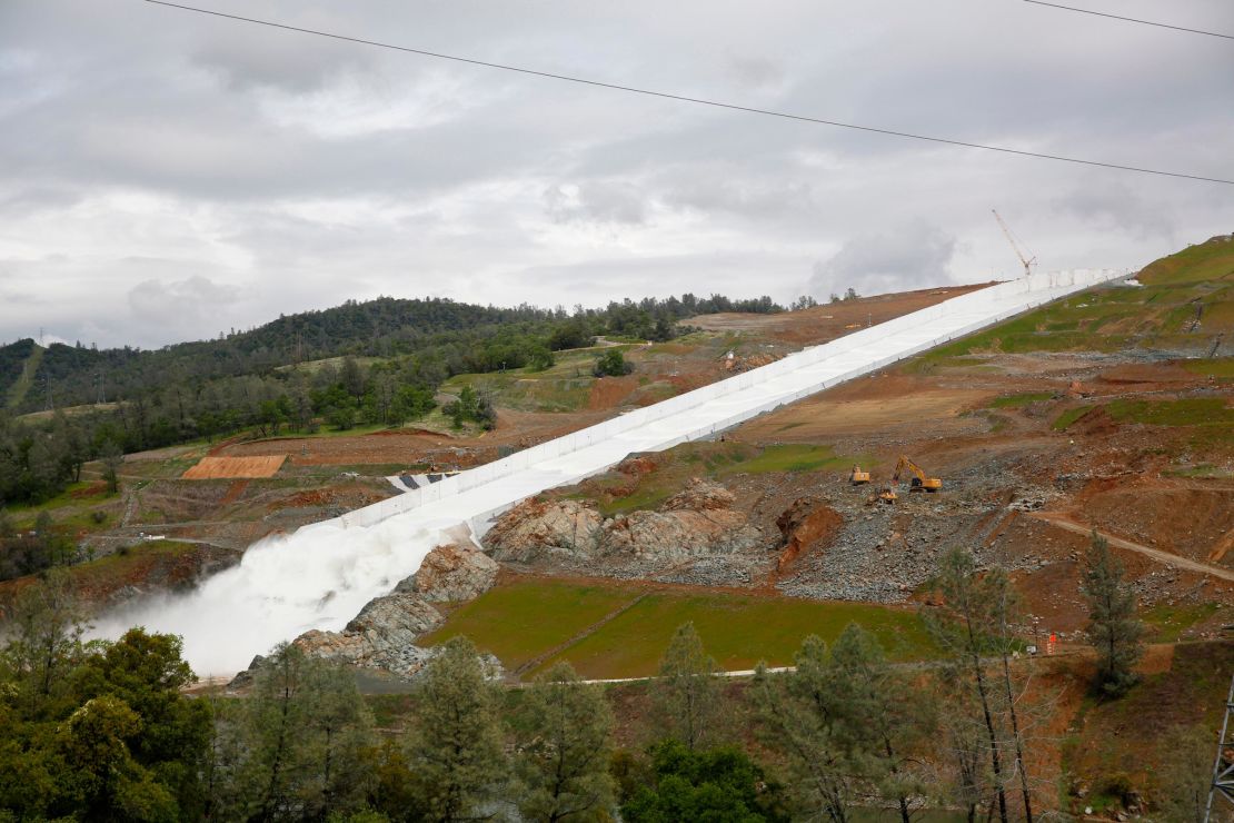 Water flows down the Oroville Dam spillway on April 2, 2019. California officials opened the flood-control spillway at the nation's tallest dam for the first time since it crumbled during heavy rains two years ago. 