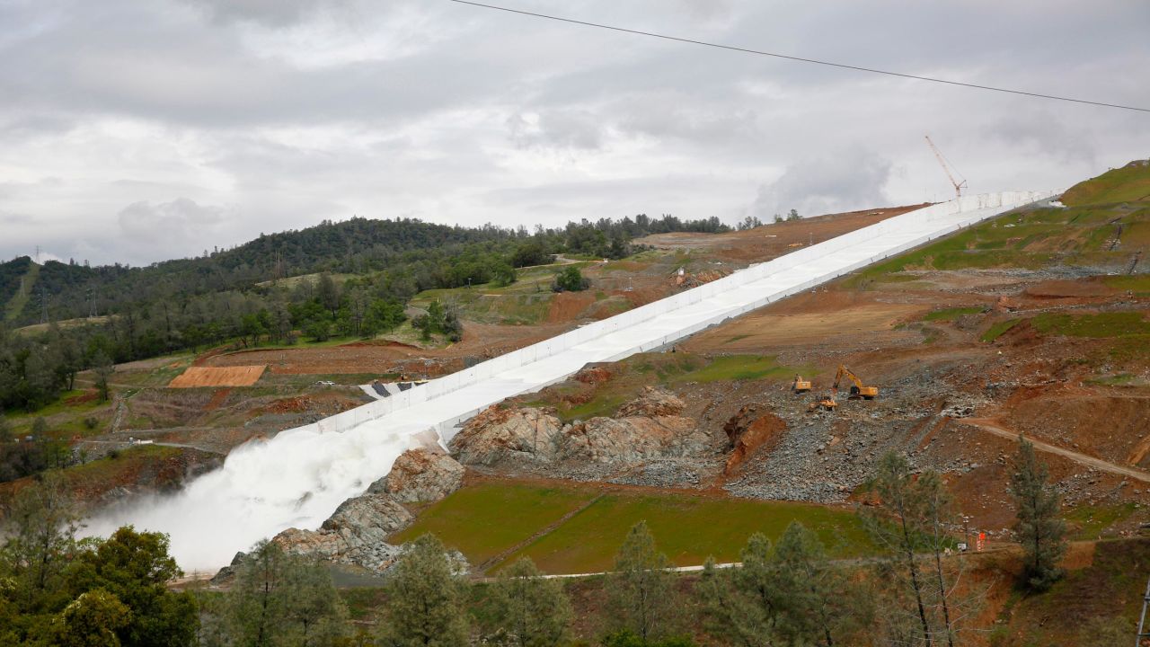 Water flows down the Oroville Dam spillway on April 2, 2019. California officials opened the flood-control spillway at the nation's tallest dam for the first time since it crumbled during heavy rains two years ago. 