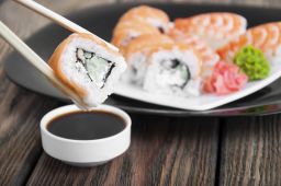 Salty foods, such as soy sauce eaten with sushi, contribute to high sodium levels in Asian diets.