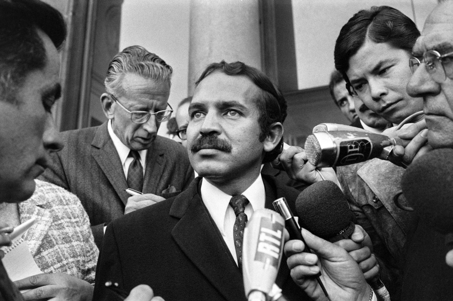 Bouteflika answers journalists' questions in Paris as he leaves a meeting with French President Georges Pompidou in September 1970.