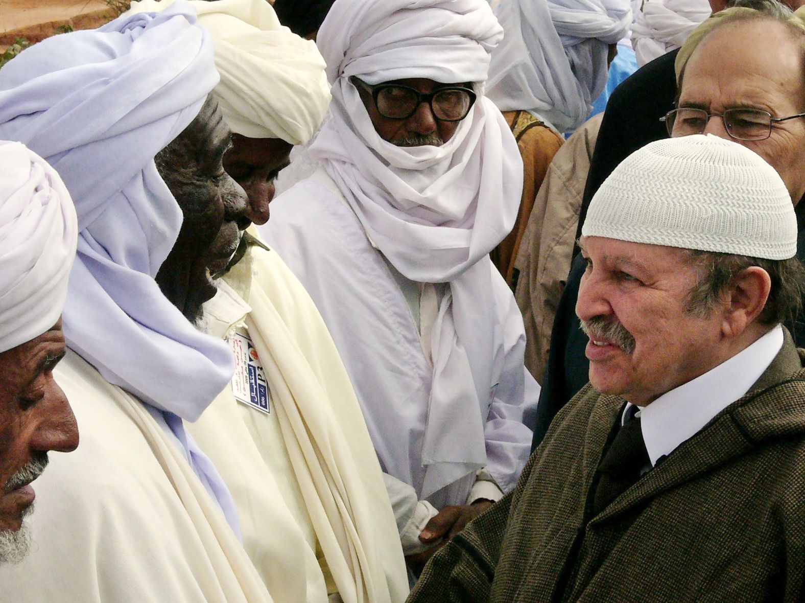 Bouteflika meets Touareg men in the Algerian town of In Salah during a visit to the Sahara desert region in January 2008. Just a few months earlier, Bouteflika narrowly escaped a bomb attack in the eastern city of Batna that killed at least 22 people waiting to see him.