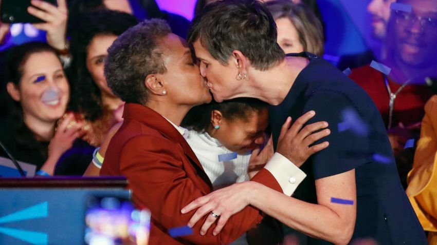 TOPSHOT - Chicago mayor elect Lori Lightfoot (L) kisses wife Amy Eshleman after speaking during the election night party in Chicago, Illinois on April 2, 2019. - In a historic first, a gay African American woman was elected mayor of America's third largest city Tuesday, as Chicago voters entrusted a political novice with tackling difficult problems of economic inequality and gun violence. Lori Lightfoot, a 56-year-old former federal prosecutor and practicing lawyer who has never before held elected office, was elected the midwestern city's mayor in a lopsided victory. (Photo by Kamil Krzaczynski / AFP)        (Photo credit should read KAMIL KRZACZYNSKI/AFP/Getty Images)