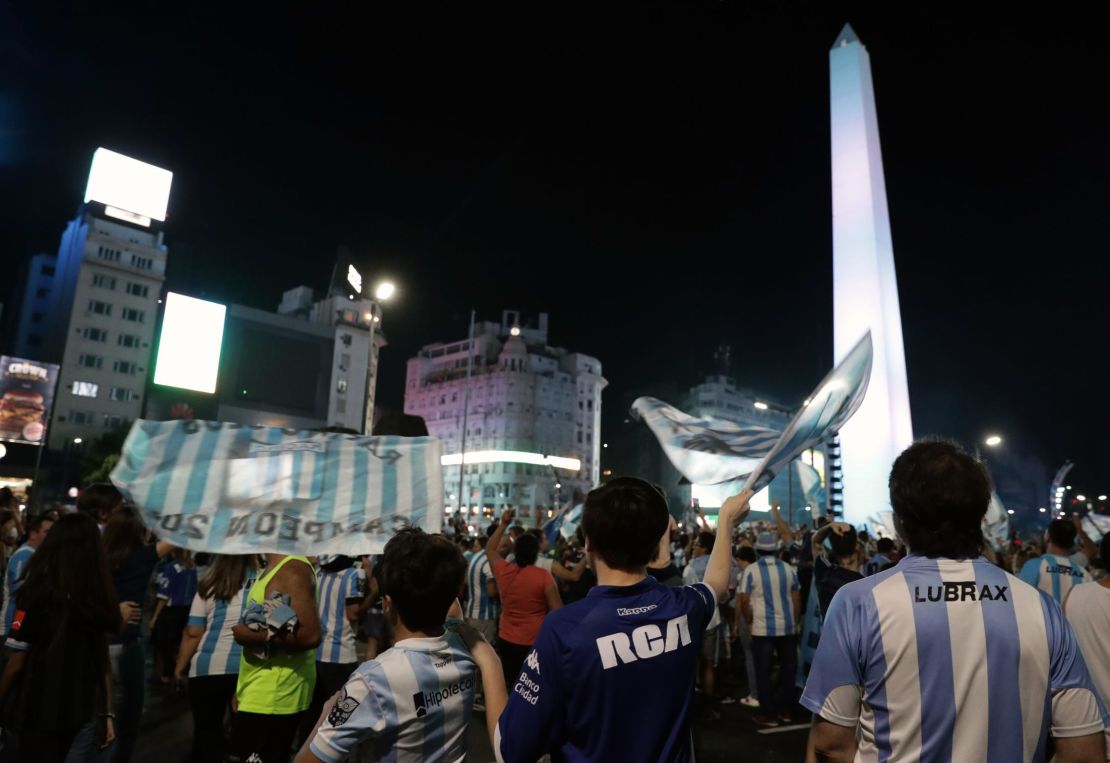 Racing Club fans celebrate at the Obelisk in Buenos Aires.