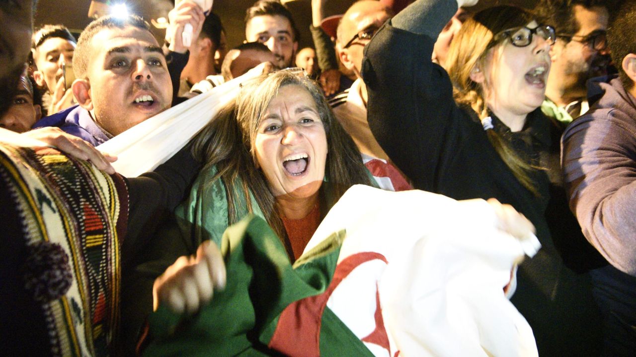 Algerians celebrate after the country's veteran President Abdelaziz Bouteflika informed the Constitutional Council that he was resigning on Tuesday. 