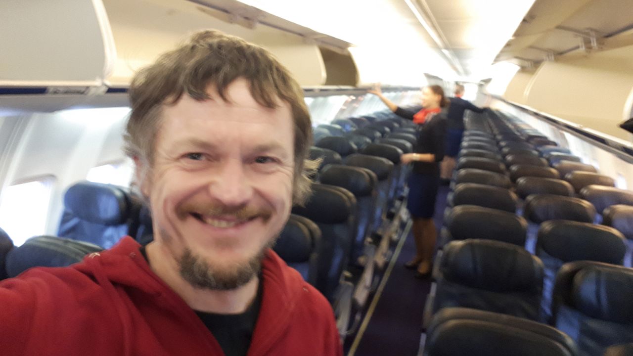 Strimaitis is outnumbered by cabin crew in this shot. 