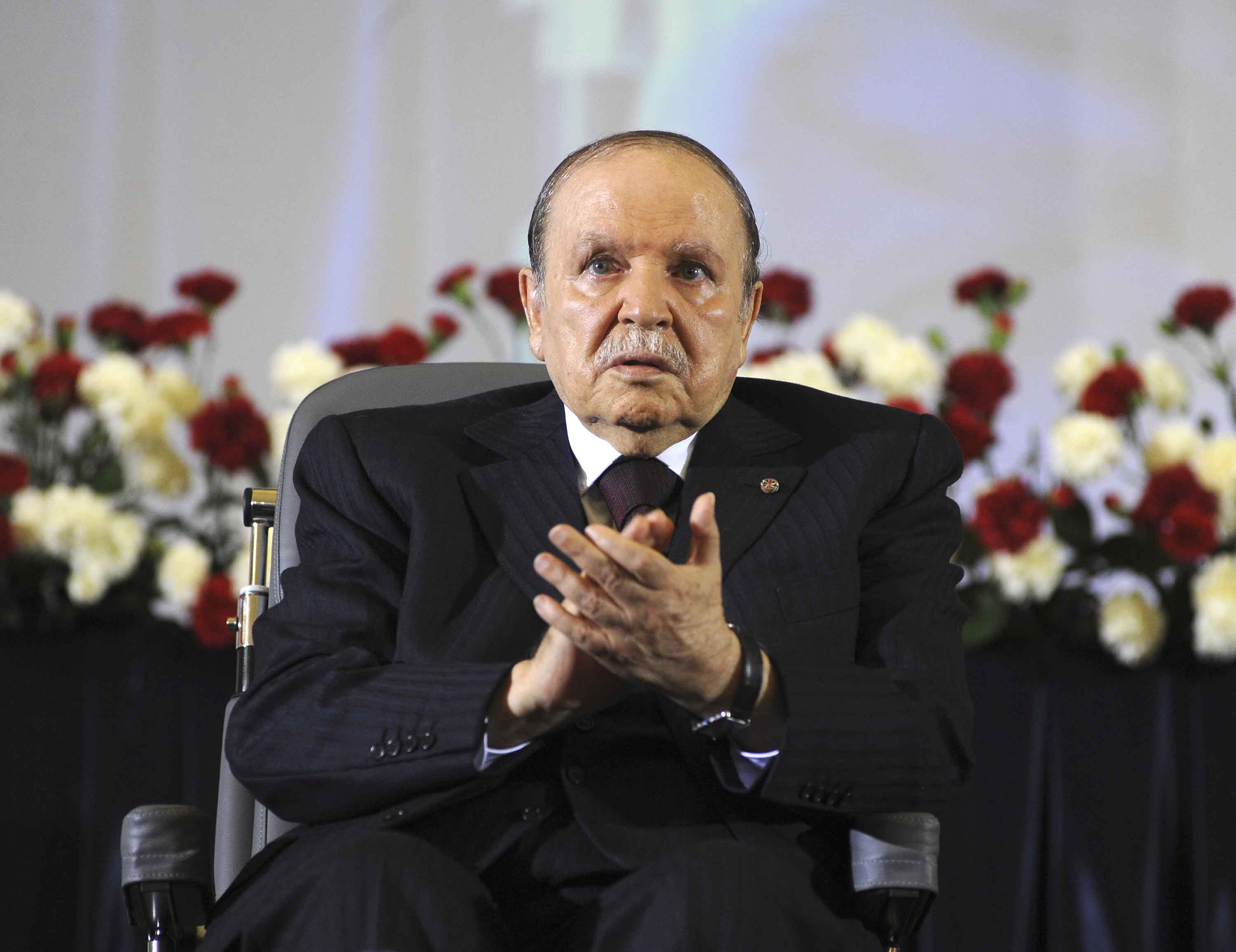 Abdelaziz Bouteflika claps after taking the presidential oath in Algiers, Algeria, in April 2014. It was the start of his fourth term.