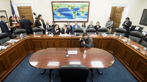 A news photographer takes a photo of the empty witness chair set for Secretary of Commerce Wilbur Ross on Wednesday, April 3, 2019.  (Photo By Bill Clark/CQ Roll Call)