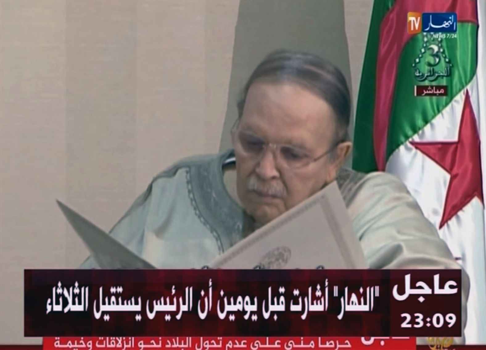 In this image from state TV broadcaster ENTV, Bouteflika reviews a document as he presents his resignation in April 2019. His resignation comes after 20 years in office and six weeks of nationwide protests aimed at pushing him and his inner circle from power.