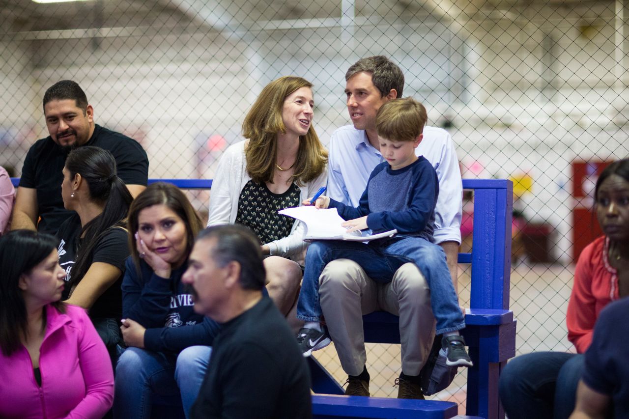 O'Rourke and his wife sit with their son Ulysses as they watch their daughter, Molly, play volleyball in February 2017.