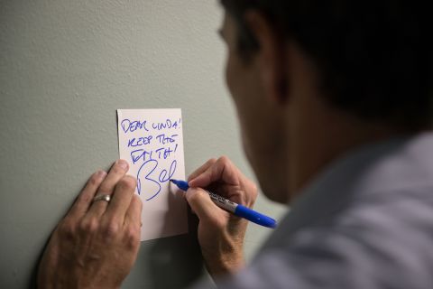 O'Rourke signs a note for a supporter after a campaign rally in Fort Worth in October 2018. It reads: "Dear Linda! Keep the faith!"