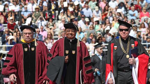From left, Peter K. Markell, Archbishop Wilton Gregory and the Rev. William P. Leahy, S.J., at the Boston College commencement in 2018. 