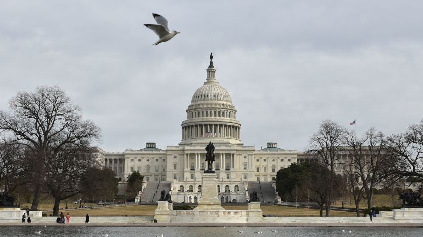 TOPSHOT - The US Capitol is seen in Washington, DC on January 22, 2018 after the US Senate reached a deal to reopen the federal government, with Democrats accepting a compromise spending bill.