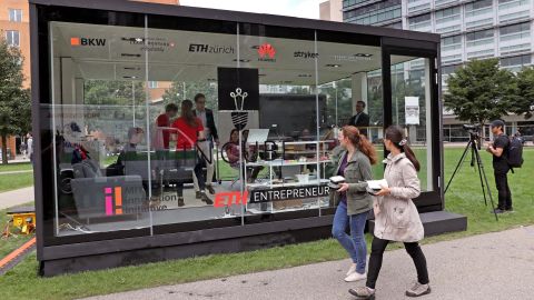 Students working in a glass cube on the Massachusetts Institute of Technology campus in 2018. The university is suspending ties with Huawei and ZTE.