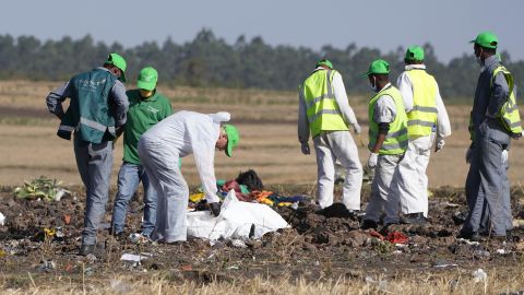 Investigators collect personal effects and other materials from the crash site of Ethiopian Airlines Flight 302.