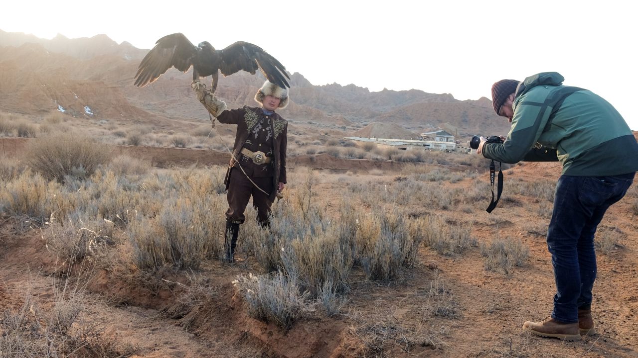 Dros shoots a traditional Kyrgyz eagle hunter. 