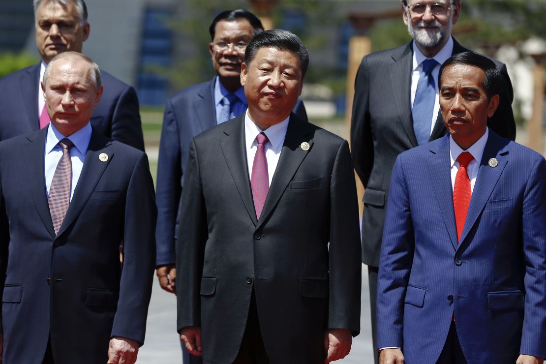 Russian President Vladimir Putin, Chinese President Xi Jinping,  Indonesia's President Joko Widodo and other delegation heads pose for a group photo as they attend the Belt and Road Forum for International Cooperation at the Yanqi Lake venue on May 15, 2017, on the outskirts of Beijing, China.