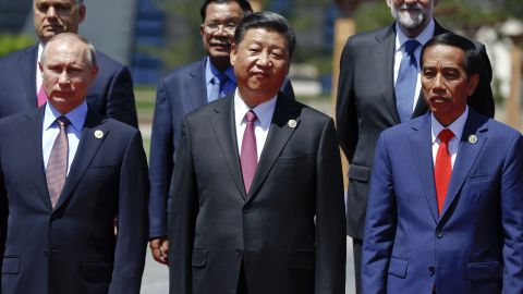 Russian President Vladimir Putin, Chinese President Xi Jinping, Indonesia's President Joko Widodo and other delegation heads pose for a group photo as they attend the Belt and Road Forum for International Cooperation at the Yanqi Lake venue on May 15, 2017, on the outskirts of Beijing, China.