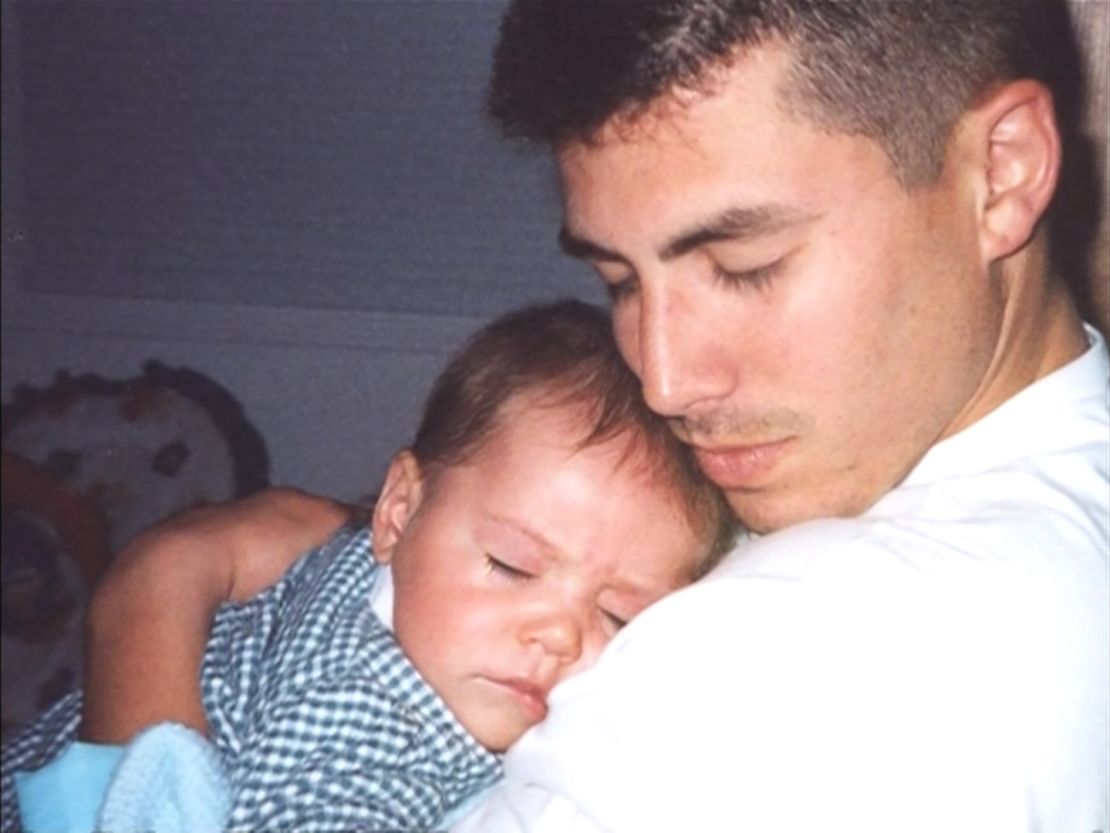 Isaac Espinoza with his baby daughter. She was three when he was killed.