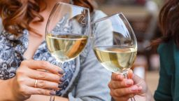 Glasses of wine in the hands of women; Shutterstock ID 496584514; Job: -