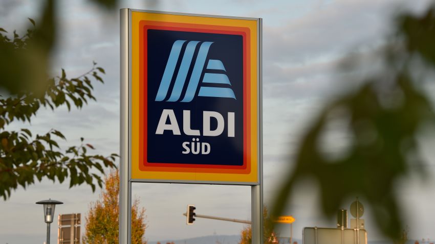 A sign with the new logo of the discount store Aldi placed in front of a branch in Schwetzingen, Germany, 03 November 2017. Photo: Sina Schuldt/dpa (Photo by Sina Schuldt/picture alliance via Getty Images)